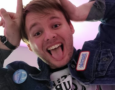 An image of the shop owner, Jacob, doing a pose similar to Eddie Munson