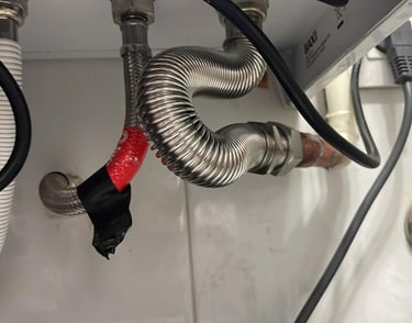 a bunch of pipes and pipes in a bathroom