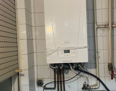a white boilerer with a remote control
