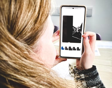 Girl making picture with cameraphone