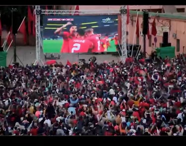 a large screen tv screen with a man in a red shirt