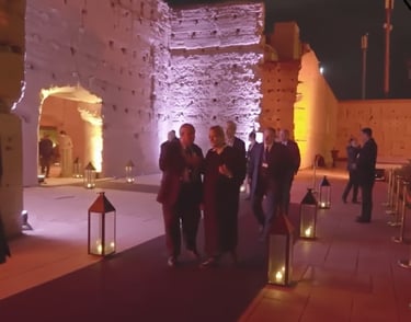 a group of people standing around a building