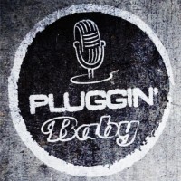 pluggin` baby radio with a microphone in a bold cirlce
