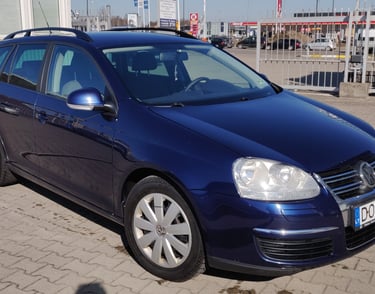 a blue volkswagen golf wagon