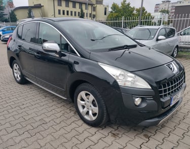 a black car parked in a parking lot