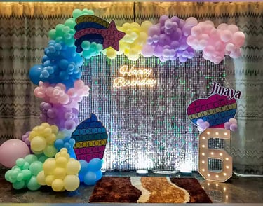 a birthday party with balloons and balloons