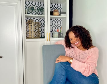 a woman sitting on a chair in a room