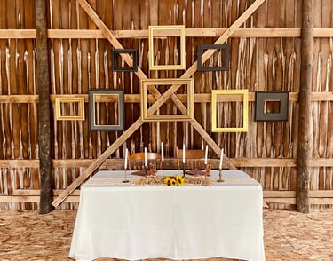 head table at wedding reception in a vintage barn