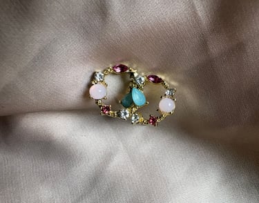 a ring with a peace sign and a peace sign