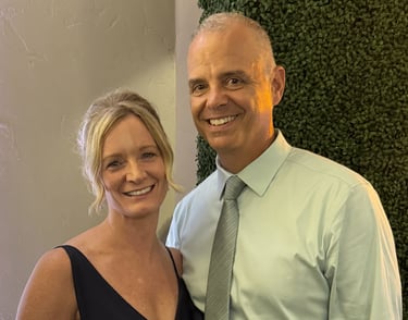 Christine and her husband smiling at a wedding in Scottsdale, Arizona after a 5-day Lumineux whiteni