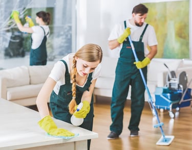 A cluttered room transformed into an organized space by our cleaning experts.