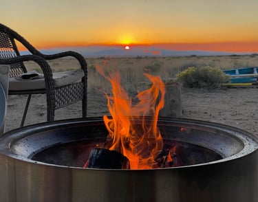 a fire pit with a fire in the middle of it