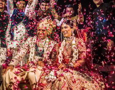 a group of people standing around a man and woman