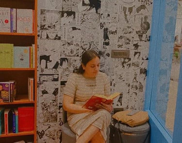A woman reading in a bookstore