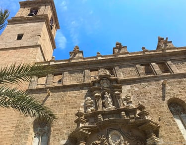 Baroque facade of San Juan del Mercado Church, a historic landmark in Valencia's vibrant Central M.