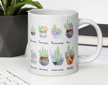 White mug with watercolor succulents on desk — plant-themed home décor from Miss Chatty Plants