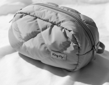 A stylish custom-made cosmetic bag showcasing King Fly's craftsmanship.