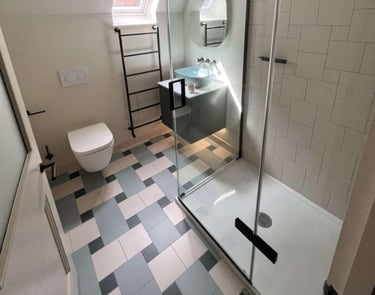 a bathroom with a shower and a toilet fitted by pbp services