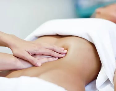a woman getting a massage at a spa