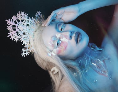 An icy makeup look where my skin is painted white, decorations everywhere.