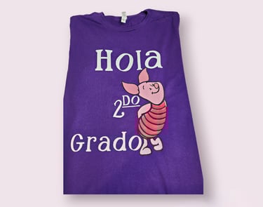 a purple T-shirt with a piggy.