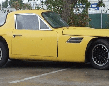 A yellow 2 door TVR Vixen classic British car.
