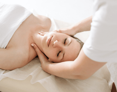a woman is getting a massage at a spa
