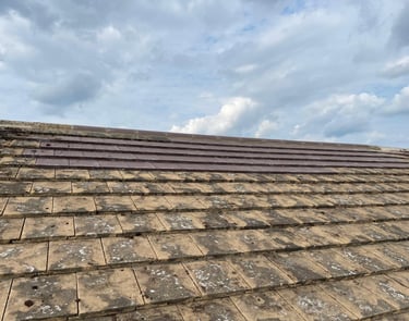 Damaged roof being repaired by experienced contractors