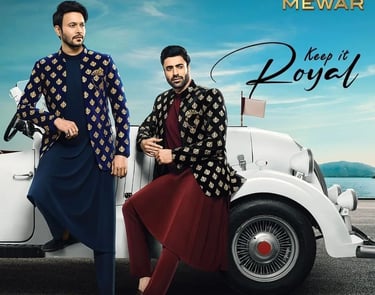 a man and woman in traditional indian attire, sitting on a car