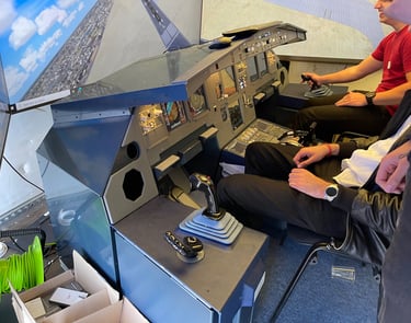 two people sitting in a plane