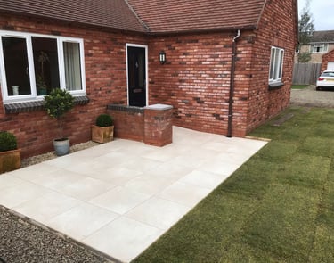slabs in front garden, landscaping job carried out lakes building and plastering services