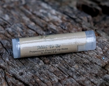 tube of lip balm on a tree stump