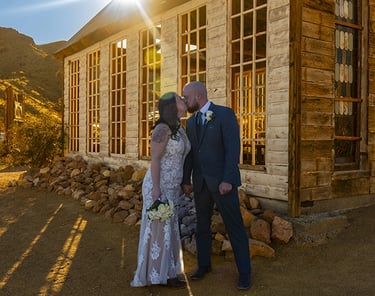 a man and woman standing in front of a church