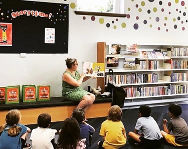 Polly Owen at Watford Central Library reading Darwin's Super-Pooping Worm Spectacular. Author events