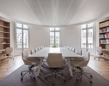 a modern conference room with a table and chairs