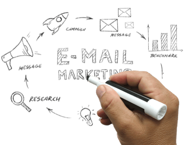 a person's hand holding a pen and drawing a house