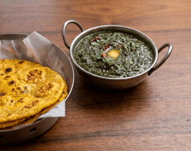 Sarson da Saag with Makki di Roti served at The Singh Saab Jamshedpur