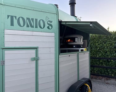 Tonio's green mobile pizzeria trailer