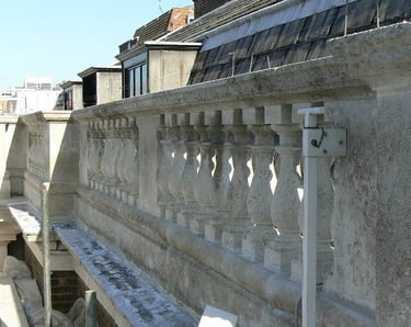 a building with Portland stone bottles waiting for restoration 