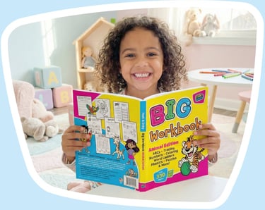 cute girl reading a copy of Fesh and Ocky's Big Workbook: Animal Edition