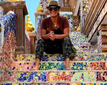 Erica surrounded by vibrant flowers and market colors, representing the creativity and personality b