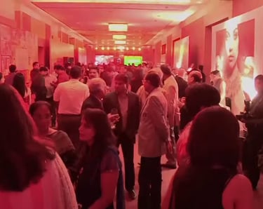 a group of people standing in a hallway with red hue