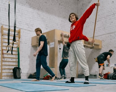 a woman in a red sweater is stretching
