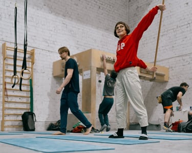 a woman in a red sweater is stretching
