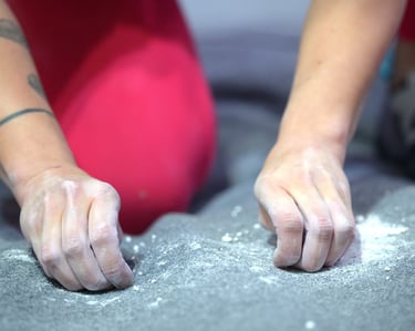 a climber is cleaning up climbing chalk