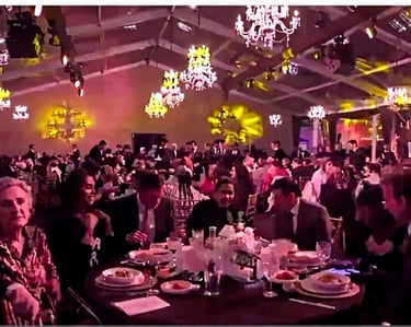 a large group of people sitting at a table