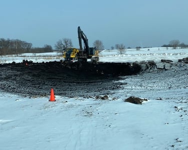 pond being excavated in the snow