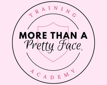 More Than A Pretty Face Training Academy logo featuring a pink shield on a light pink background.