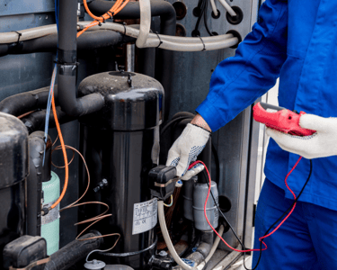 a man in a blue uniform is holding a red object