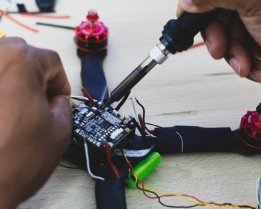 a person is working on a small device